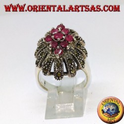 Silver ring, oval high with 9 rubies set surrounded by marcasites