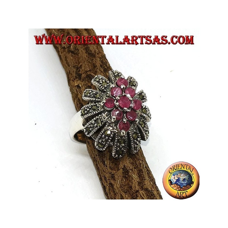 Silver ring, oval high with 9 rubies set surrounded by marcasites