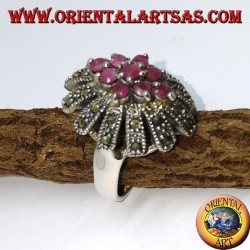 Silver ring, oval high with 9 rubies set surrounded by marcasites