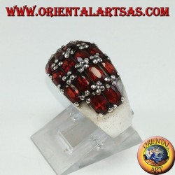 Silver ring with a rounded band with 16 oval natural garnets