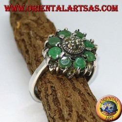 Silver ring in flower with 8 natural round emeralds surrounded by marcasites