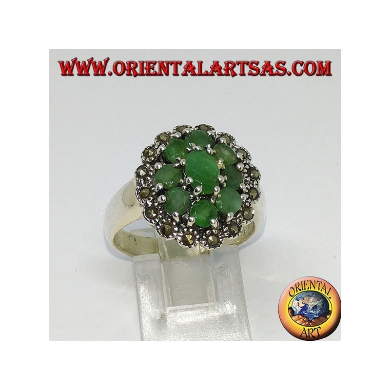 Silver ring in flower with 8 natural round emeralds surrounded by marcasites