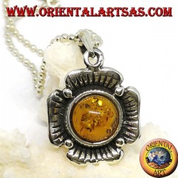Silver pendant in the shape of a flower with a central hemispherical amber