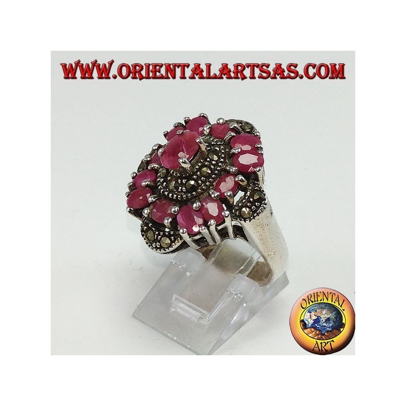 Silver ring with 13 oval rubies set and adorned with marcassite