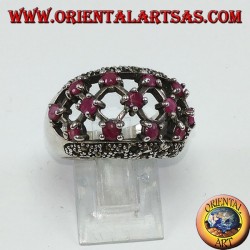 Silver ring with rounded perforated band with 13 round set rubies