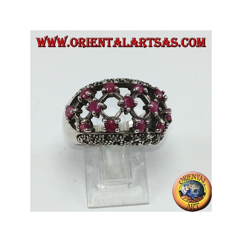 Silver ring with rounded perforated band with 13 round set rubies