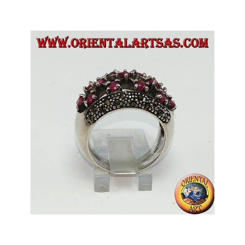 Silver ring with rounded perforated band with 13 round set rubies