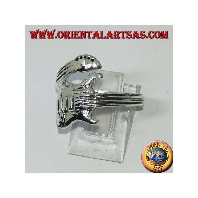 Silver ring wrapping electric guitar, horizontally