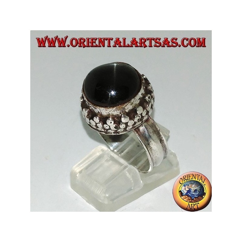 Silver ring on high edge with round Black Star set