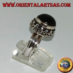 Silver ring on high edge with round Black Star set