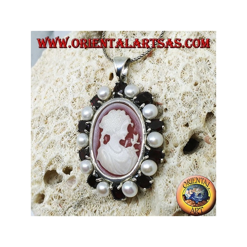 Silver pendant with cameo on mother of pearl surrounded by pearls and garnets