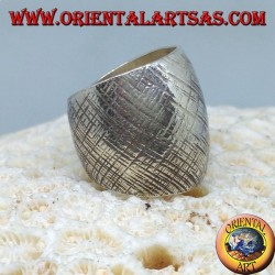 Silver ring with curved band with handmade crossed stripes