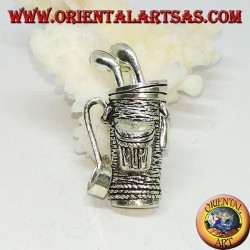 Silver pendant, golf bag with clubs