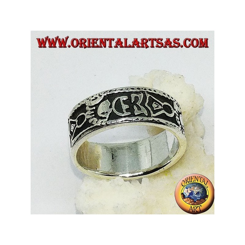Silver band ring with Maori bas-relief designs