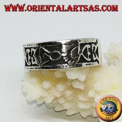 Silver band ring with Maori bas-relief designs