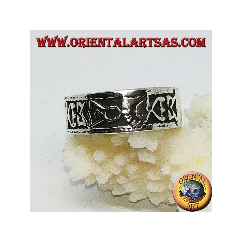 Silver band ring with Maori bas-relief designs