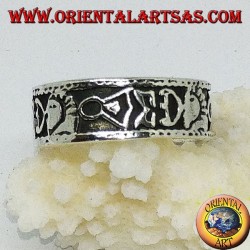 Silver band ring with Maori bas-relief designs