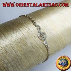 Pulsera de plata suave con una clave de sol en el centro.