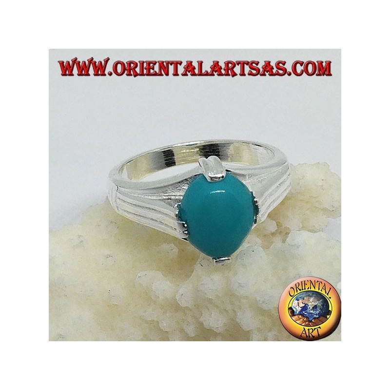 Anillo de plata con turquesa ovalada en cuatro puntos.