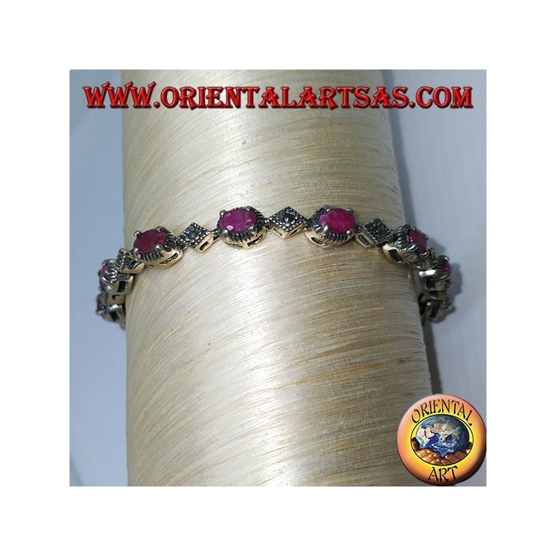 Bracciali in argento con 12 rubini ovali  incastonati da 4 griffe, e marcasite