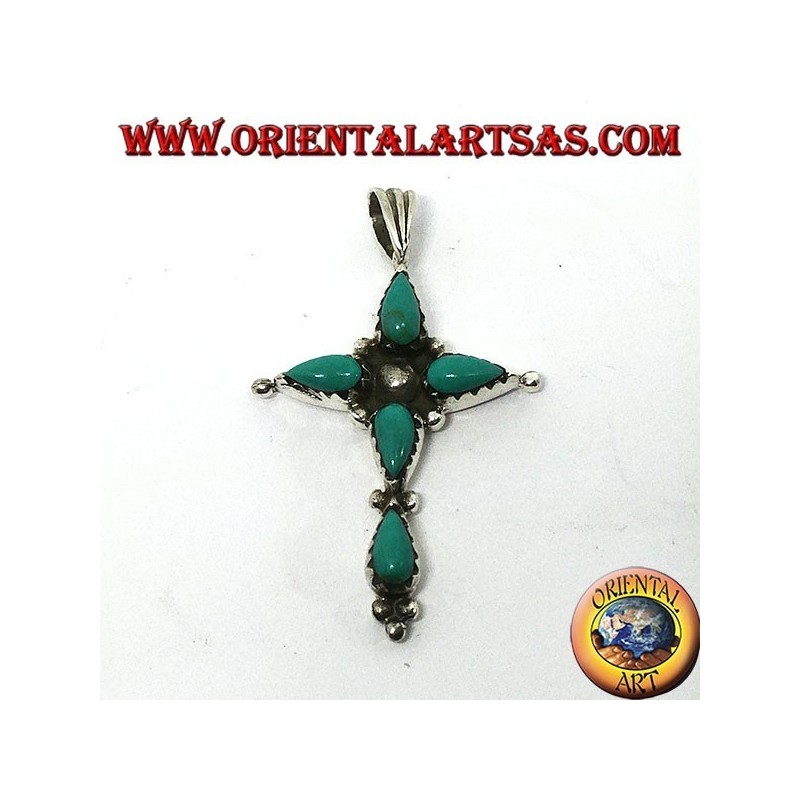 Cruz de plata con cinco turquesas en forma de gota.