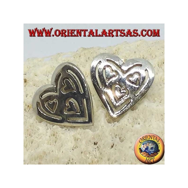 Silver lobe earrings in pierced heart of other 3 hearts