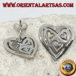 Silver lobe earrings in pierced heart of other 3 hearts