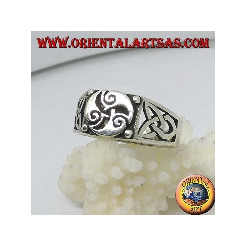 Silver ring with triskele three spirals and Tyrone knots on the sides