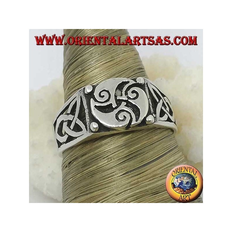 Silver ring with triskele three spirals and Tyrone knots on the sides