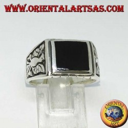 Silver ring with rectangular onyx and bas-relief eagles on both sides