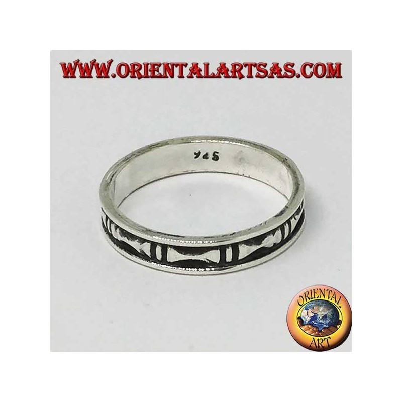 Silver band ring with hollow bas-relief bones
