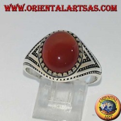 Silver ring with oval carnelian set with triangles and lateral dot decorations