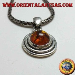 Silver pendant with a round amber, and two-wax edge