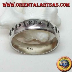 Silver band ring with alternating engraved stars and staves