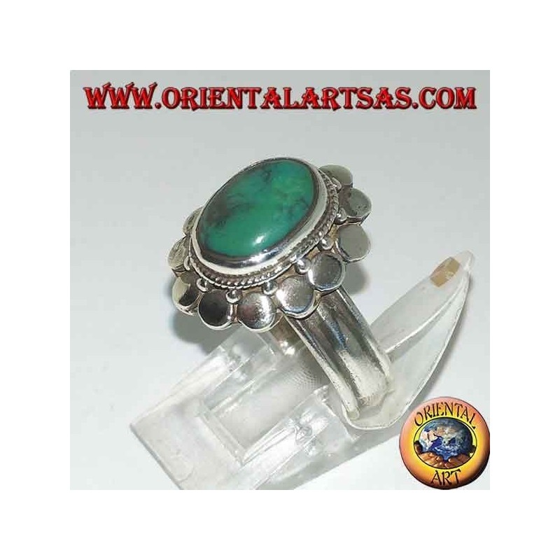 Silver ring with natural antique oval turquoise, edged with round plates