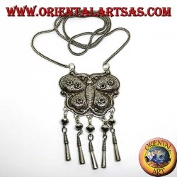 Long silver necklace with a butterfly-shaped medallion and pendants
