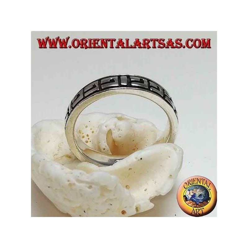 Silver band ring with Greek bas-relief decorations