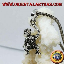 Colgante de plata, mono que se masturba moviendo la cabeza con los brazos