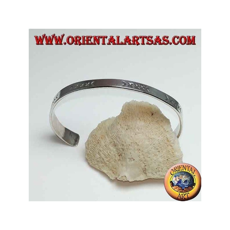 Flat rigid silver hand-engraved bracelet with wider end