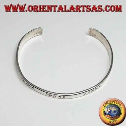 Flat rigid silver hand-engraved bracelet with wider end