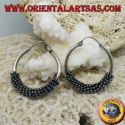 Silver hoop earrings twisted into a spiral