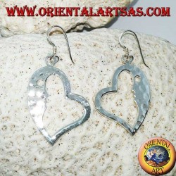 Hammered silver heart-shaped earrings with a striking face on the inside