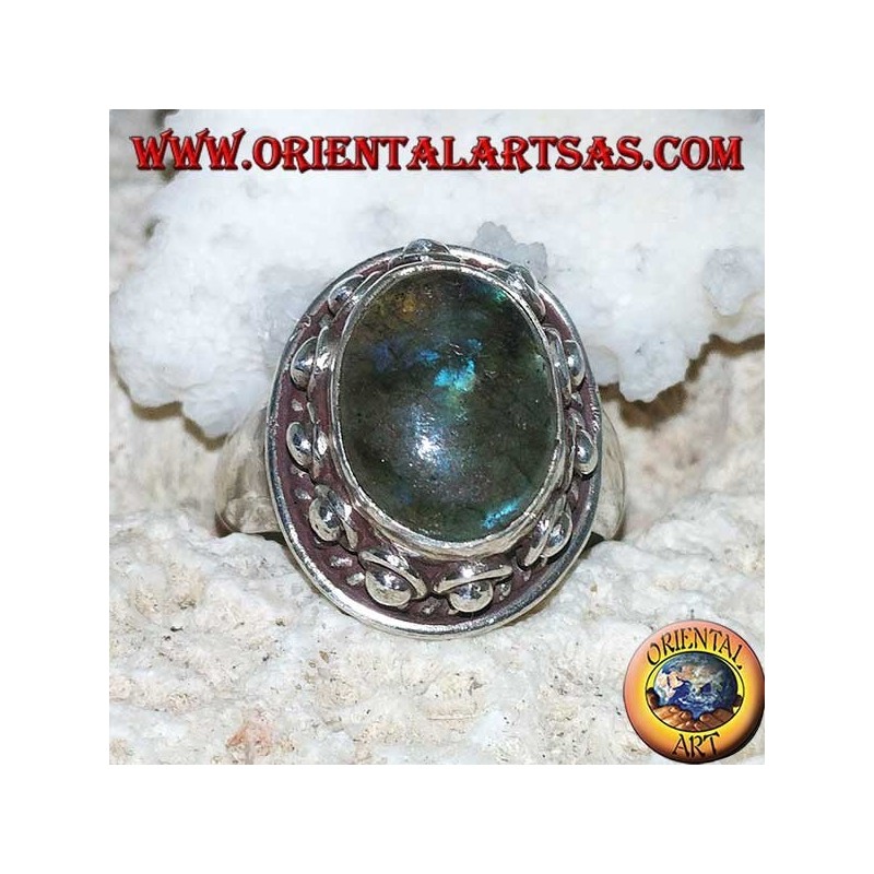 Silver ring with oval labradorite with blue reflections and studded setting