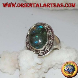 Silver ring with oval labradorite with blue reflections and studded setting
