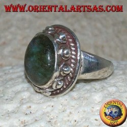 Silver ring with oval labradorite with blue reflections and studded setting