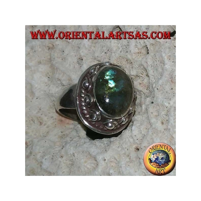 Silver ring with oval labradorite with blue reflections and studded setting