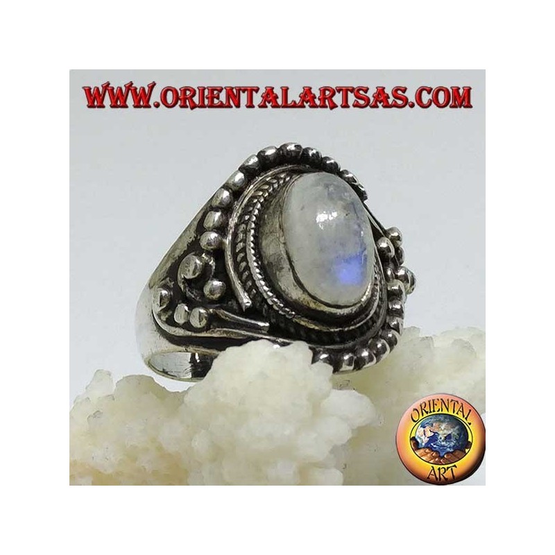 Silver ring with oval rainbow moonstone with asymmetrical ball decorations