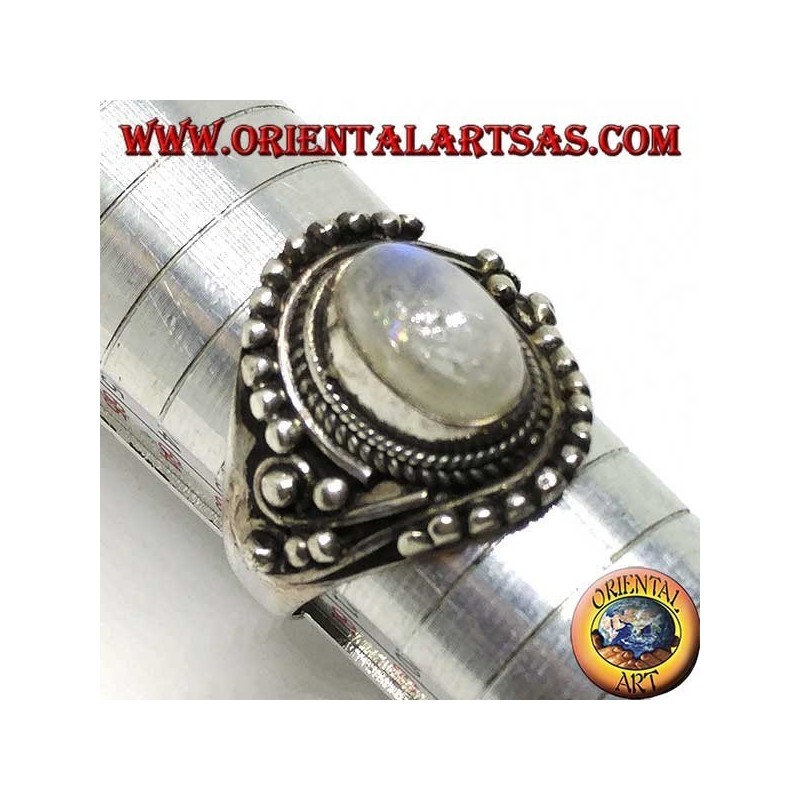 Silver ring with oval rainbow moonstone with asymmetrical ball decorations