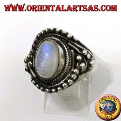 Silver ring with oval rainbow moonstone with asymmetrical ball decorations