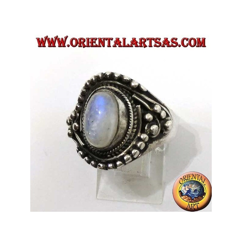 Silver ring with oval rainbow moonstone with asymmetrical ball decorations